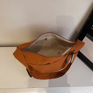 Spacious caramel canvas tote bag with adjustable wide strap for summer daily commute