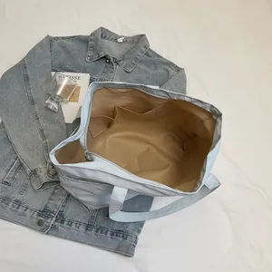 Light blue large canvas tote bag with spacious interior and zipper for daily commute