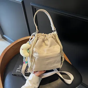 Korean Style Nylon Pleated Drawstring Bucket Bag For Women Fashion Minimalist Shoulder Bag With Plush Charm Accessory