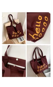 Detail of burgundy canvas tote with magnetic clasp and internal zipper pocket