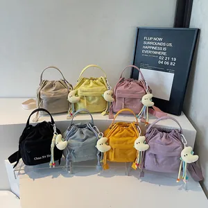 Minimalist nylon drawstring shoulder bags in seven colors with moon plush charms and beads