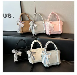 Sacs seaux chics avec nœuds en dentelle et poignées tressées en six coloris variés