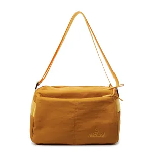 Waterproof multi-compartment crossbody bag in ginger yellow with adjustable strap