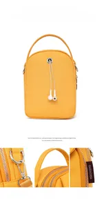 Detail of yellow nylon crossbody phone bag with headphone port and silver hardware