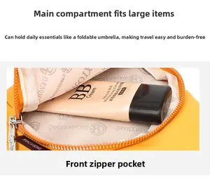 Detail of a bright yellow compact crossbody bag showing its spacious inner compartment