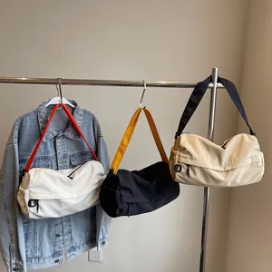 Chic nylon crossbody bag with wide shoulder strap in multiple colors for daily casual use