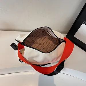 Minimalist beige and orange crossbody shoulder bag with large capacity and zip closure