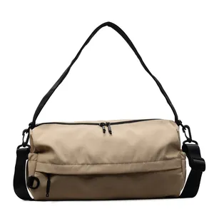 Minimalist khaki cylinder crossbody bag with large capacity and nylon shoulder strap