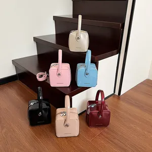 Glossy patent leather box handbags in six assorted colors with heart charms