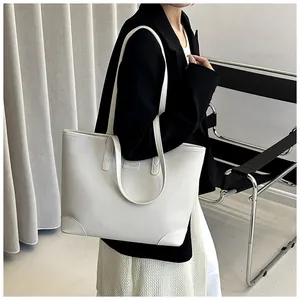 Detail of white lychee texture tote bag with dual straps and reinforced bottom edges