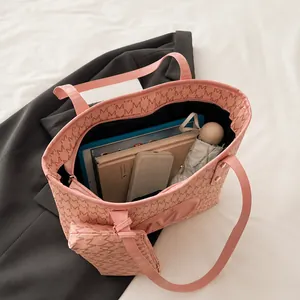 Pink monogram tote bag interior showing large capacity for iPad, umbrella and daily items