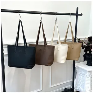 Litchi pattern leather tote bags in black brown beige and khaki on elegant display