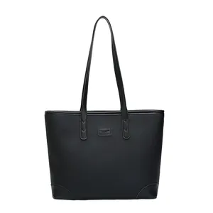 Large black leather tote bag with pebble grain texture and dual long shoulder straps