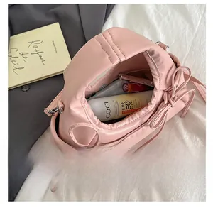 Interior view of pink bow tote bag showing large capacity for cosmetics and daily items