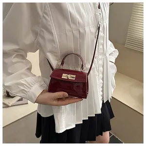 Fashionable wine red patent leather mini crossbody bag with gold metal twist lock and handle