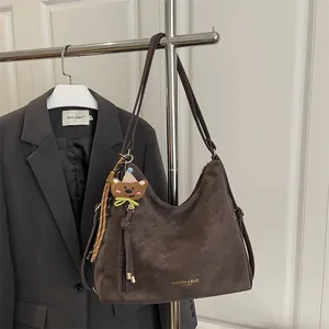Dark coffee large tote bag with bear charm and striped scarf on shoulder strap