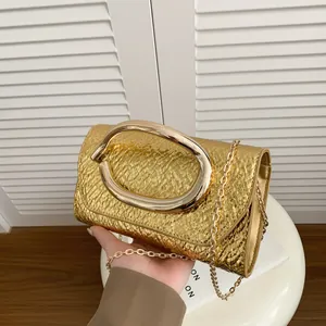 Chic gold square crossbody bag with snakeskin texture and metal ring handle for women