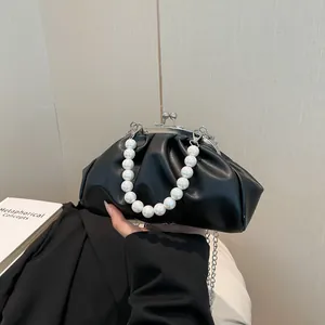 Fashionable black pleated cloud bag with pearl chain handle and metal clasp closure
