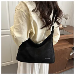 Minimalist black matte shoulder tote bag with adjustable strap for commuting