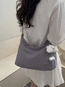 Minimalist purple faux leather shoulder bag with white cloud charm and stitch detail