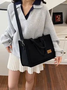 Classic black canvas tote bag for women with crossbody strap and large capacity