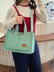Mint green canvas tote bag for women with adjustable strap and multiple pockets