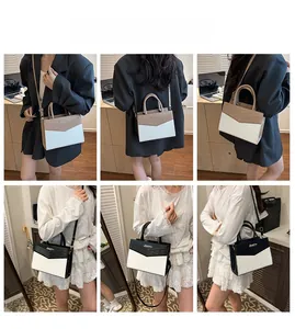 Detail shots of two-tone crossbody bag with V-shaped stitching and metallic logo accent