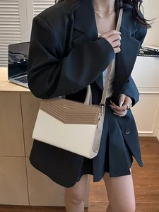 Chic color-block rectangular handbag with V-quilt stitching and gold metal logo detail