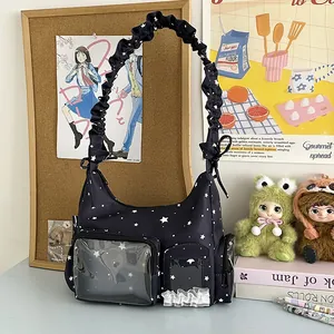 Schwarze Ita-Tasche mit Sternenmuster, Sichtfenstern und gerüschtem Schultergurt