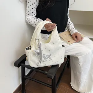 Sac à main en toile beige avec broderie chiot en paillettes et imprimé d'étoiles