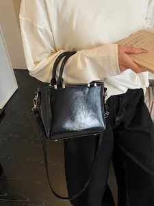 Classic black patent leather small square handbag with gold hardware for women