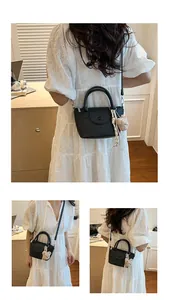 Litchi pattern leather mini handbag with teddy charm and detachable strap detail