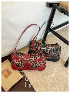 Leopard print underarm bags with buckle detail and metal rings in red and black