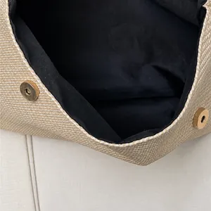 Detailed macro view of beige woven bag featuring secure dual magnetic closure design