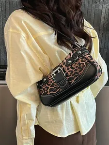 Retro leopard print hobo bag with vintage buckle and rivet accents for elegant styling