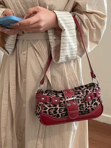 Retro leopard print shoulder bag with red leather straps and silver buckle detail