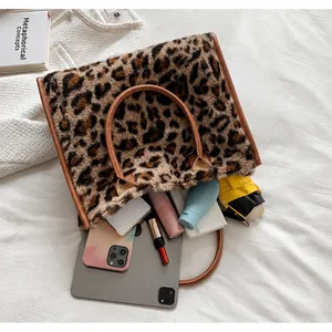 Detailed interior view of a large leopard print plush tote bag showing spacious capacity