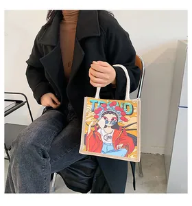 Detail of linen tote bag featuring a modern Peking Opera girl print with rope handles
