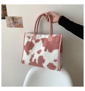 Dettagli della borsa tote grande in pelliccia sintetica zebrata rosa e bianca