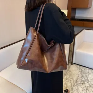 Minimalist brown vintage faux leather tote bag with long shoulder straps for daily use