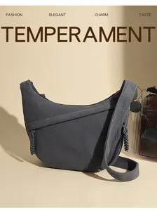 Detailed texture of dark grey corduroy shoulder bag with woven knot strap decoration