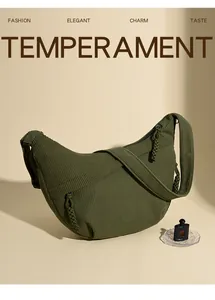 Detail of olive green corduroy crescent bag with textured fabric and woven zipper pull