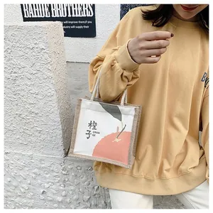 Linen canvas mini tote bag featuring orange fruit print and woven handles in street style