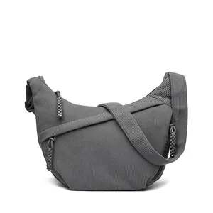 Dark grey corduroy crescent crossbody bag for women with wide strap and zip detail