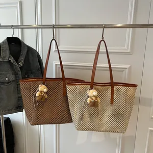 Large capacity woven straw tote bag with bear charm pendant and leather straps