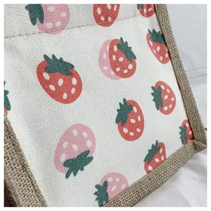 Close-up of strawberry print canvas bag showing detailed fabric texture and neat stitching