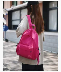 Sac à dos en nylon rose vif à grande capacité avec poches latérales à cordon
