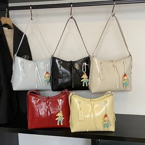 Minimalist soft leather hobo bags in five colors with long tassels and doll pendant
