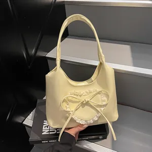 Borsa tote alla moda giallo crema con pizzo a cuore e fiocco per donne chic