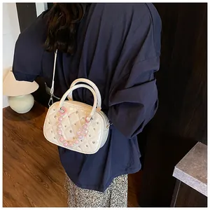 Quilted white patent leather handbag with pink pearl bow chain and metal studs